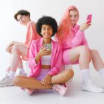 cheerful-multiracial-teenagers-in-trendy-outfit-with-smartphones