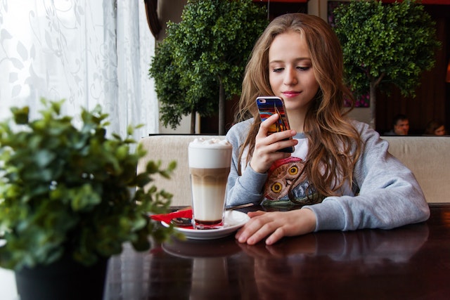 portrait-of-woman-photographing-with-smart-phone