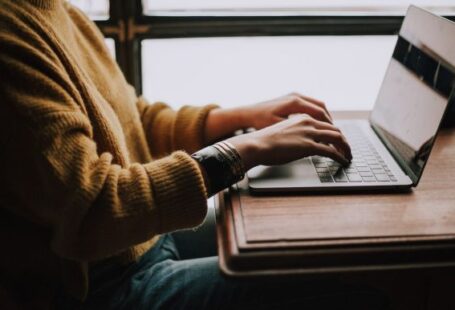 Laptop - person sitting front of laptop