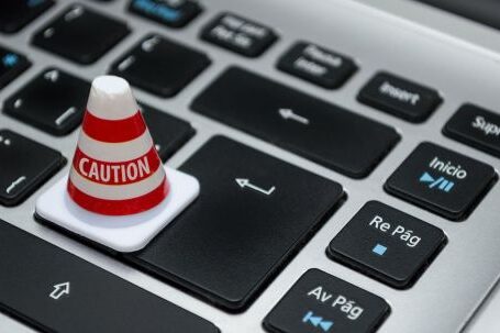 Data Protection - White Caution Cone on Keyboard