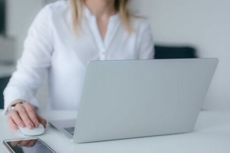 Computer - Woman Using Silver Laptop