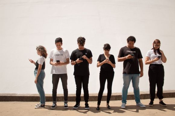 Smartphone - group of people standing on brown floor