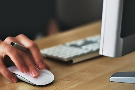 Computer - Person Holding Apple Magic Mouse