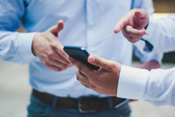 Smartphone - person holding black smartphone