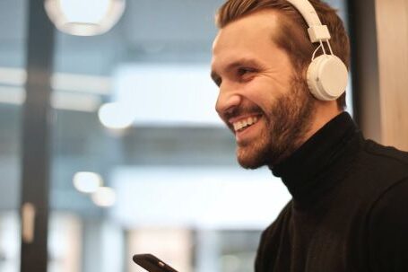 Headphones - Man Wearing White Headphones Listening to Music