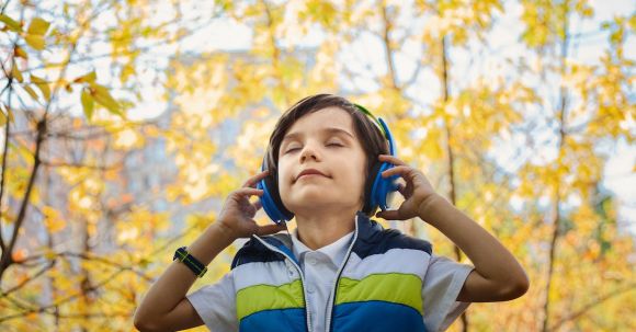 Headphones - Photo of a Boy Listening in Headphones