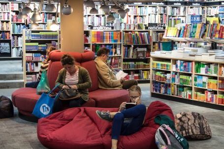 E-Readers - Full Length of Man Sitting on Floor