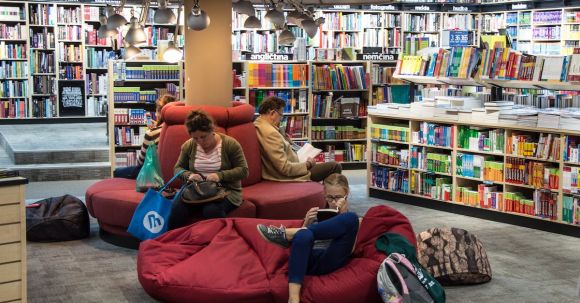 E-Readers - Full Length of Man Sitting on Floor