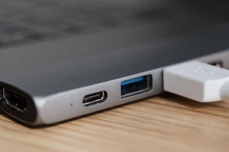 Smart Plugs - USB type c multiport adapter with plugged white cable connected to modern laptop