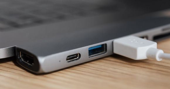 Smart Plugs - USB type c multiport adapter with plugged white cable connected to modern laptop