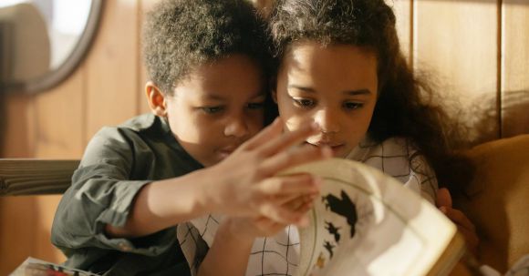 E-Readers - Two Kids Reading a Fairy Tale Book