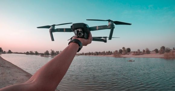 Drones - Photo of a Person Holding a Drone