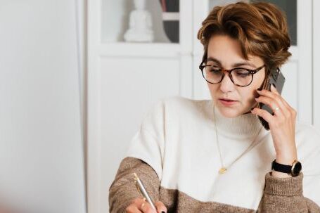 Prescription Smart Glasses - Modern businesswoman in casual outfit talking on mobile in office