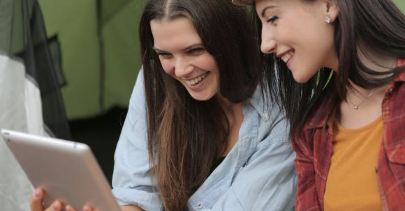 Best Tablet - Photo of Women Smiling While Looking at Ipad