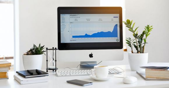 Set Up Dual Monitor - Silver Imac Displaying Line Graph Placed on Desk