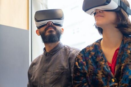 VR Games - A Man and a Woman Wearing Virtual Realty Gogges