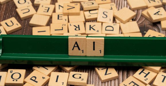 Quantum Computing - A green scrabble board with letters spelling out ai