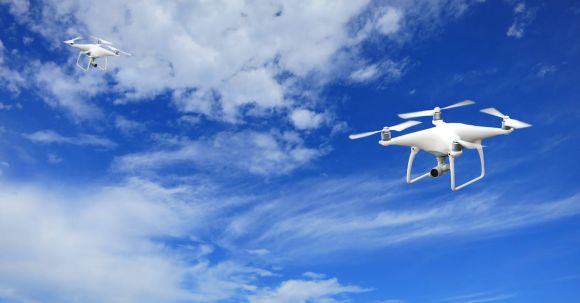 Drones - 2 Quadcopter Under Blue Sky and White Clouds