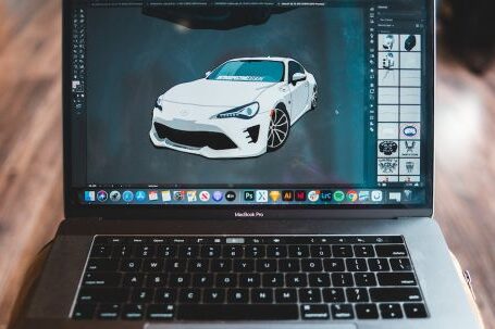 Art And Design Apps - Picture of sports car in graphic editor application on screen of modern laptop