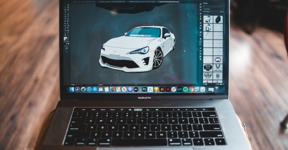 Art And Design Apps - Picture of sports car in graphic editor application on screen of modern laptop