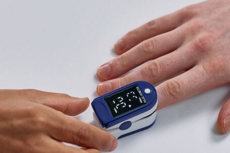 Heart Rate Monitoring - Index Finger in Blue Pulse Oximeter