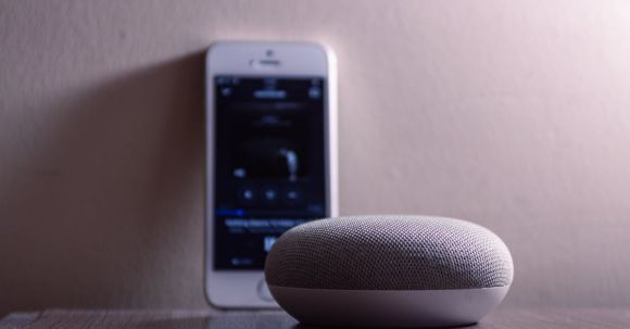 Bluetooth Speaker - Gray Google Home Mini Beside Silver Iphone 5s