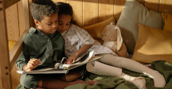 E-Readers - Two Kids Reading a Fairy Tale Book