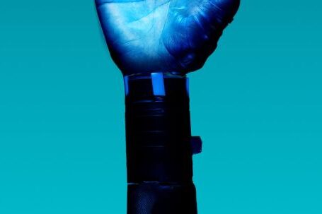 AI Innovation - Prosthetic Arm on Blue Background