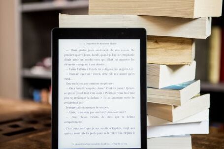 E-Readers - Black Tablet Computer Behind Books
