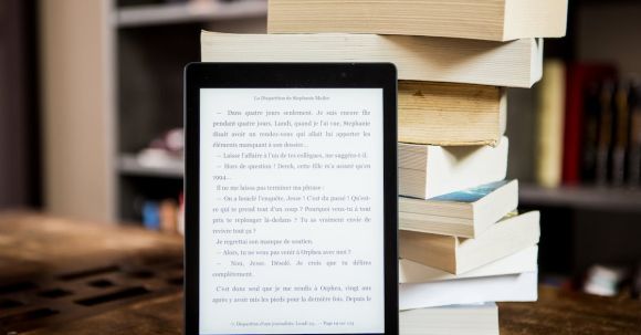 E-Readers - Black Tablet Computer Behind Books