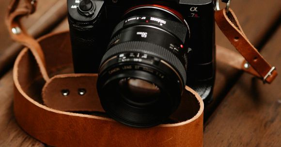 Mirrorless Cameras - Black Camera With Brown Leather Strap