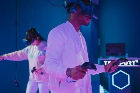 VR Headsets - Man Playing a Video Game while Wearing a VR Headset
