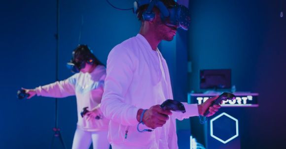 VR Headsets - Man Playing a Video Game while Wearing a VR Headset